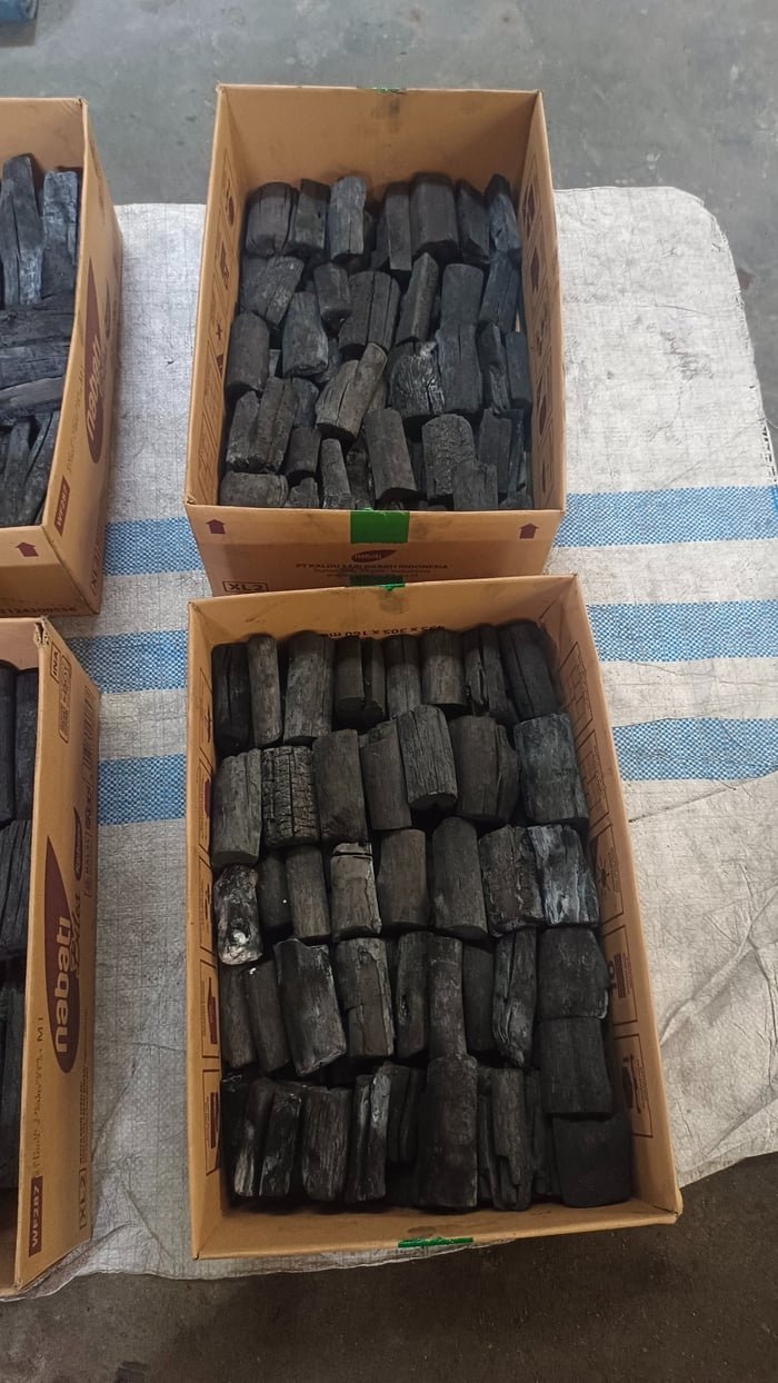 Open cartons of sorted binchotan white charcoal