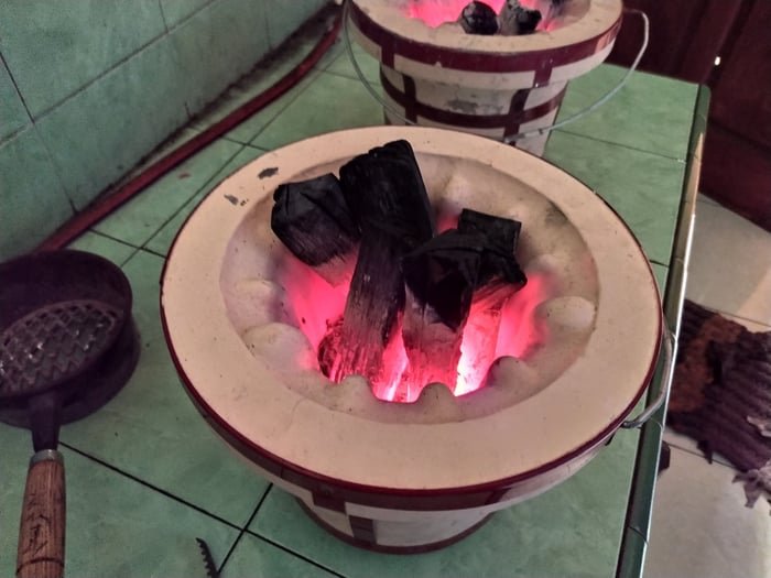 Binchotan white charcoal glowing in a ceramic konro grill