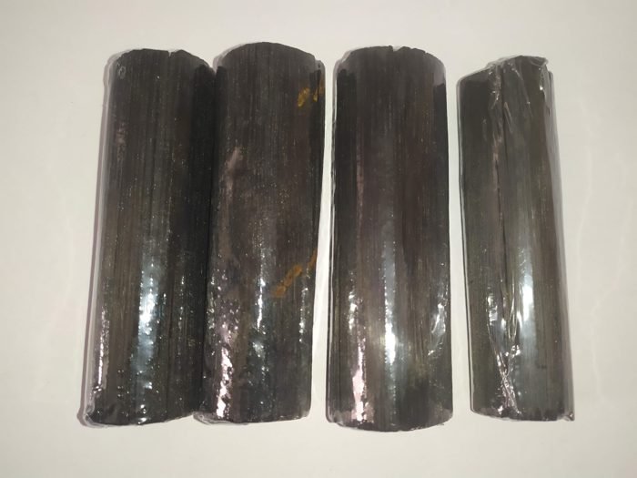 Four binchotan charcoal water sticks, each sealed in plastic